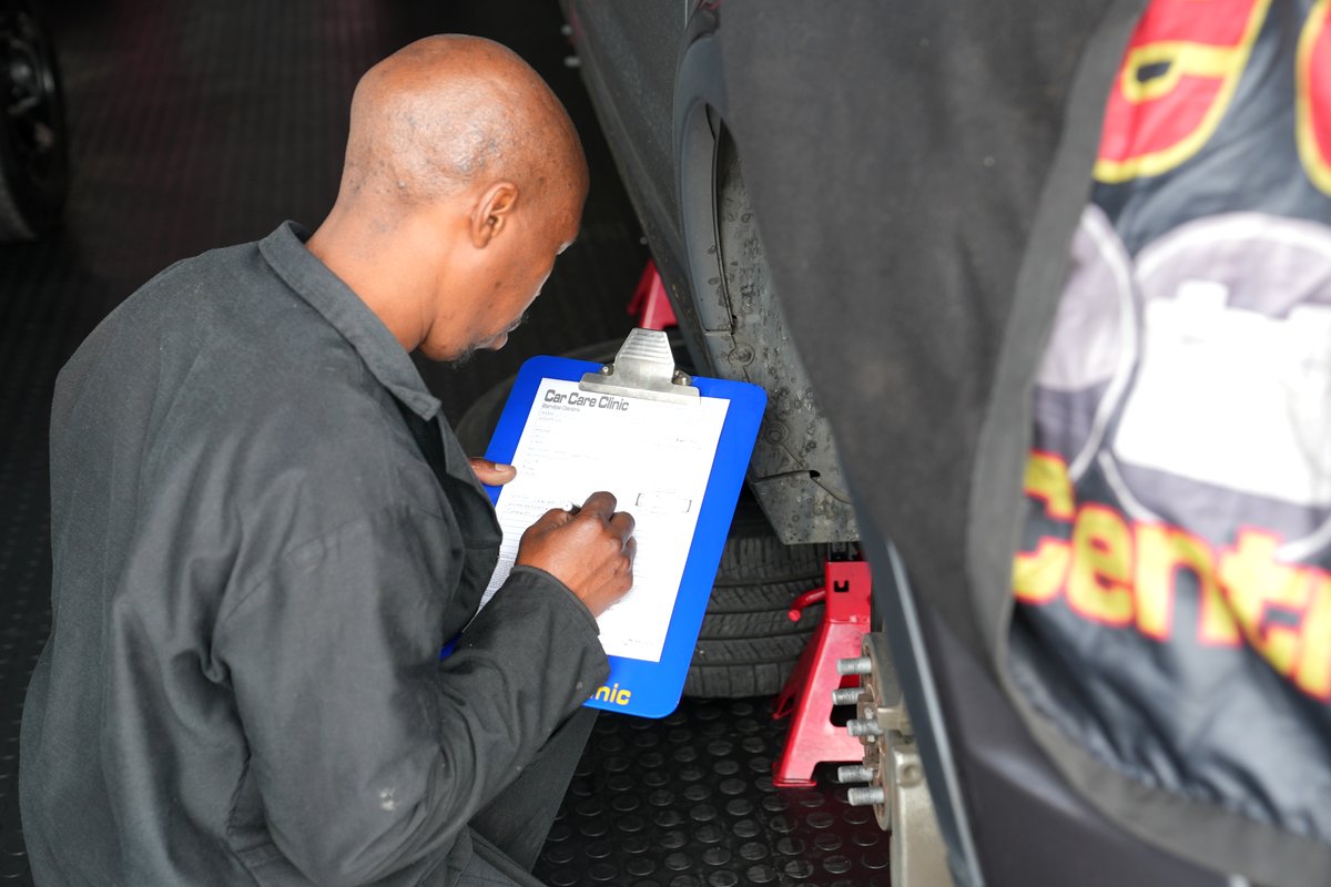 Technician completing a 76 point safety check sheet at Car Care Clinic Sunninghill